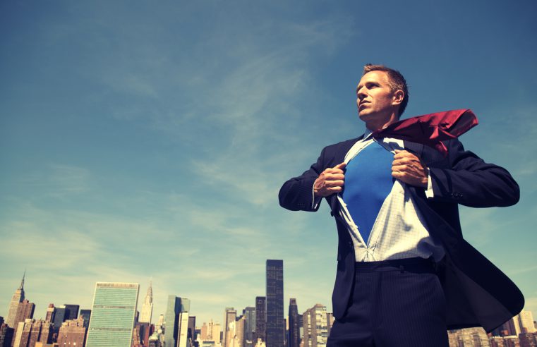 Superhero Young Man Businessman Standing Outdoors Over City Skyline