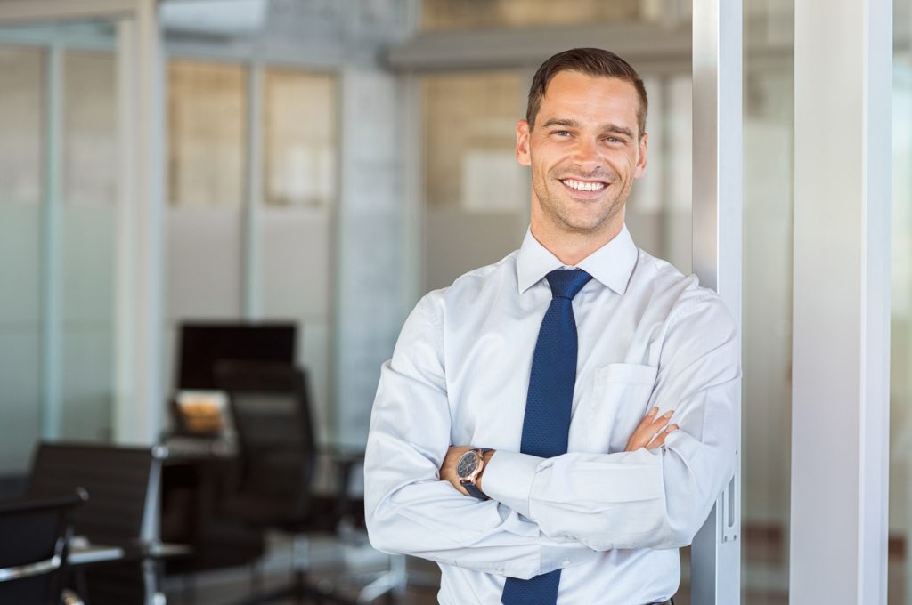 smiling businessman displays integrity as he represents his profession