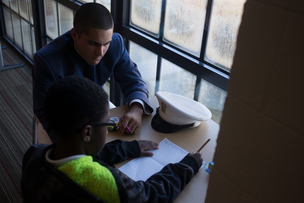 Cadet Helping Student