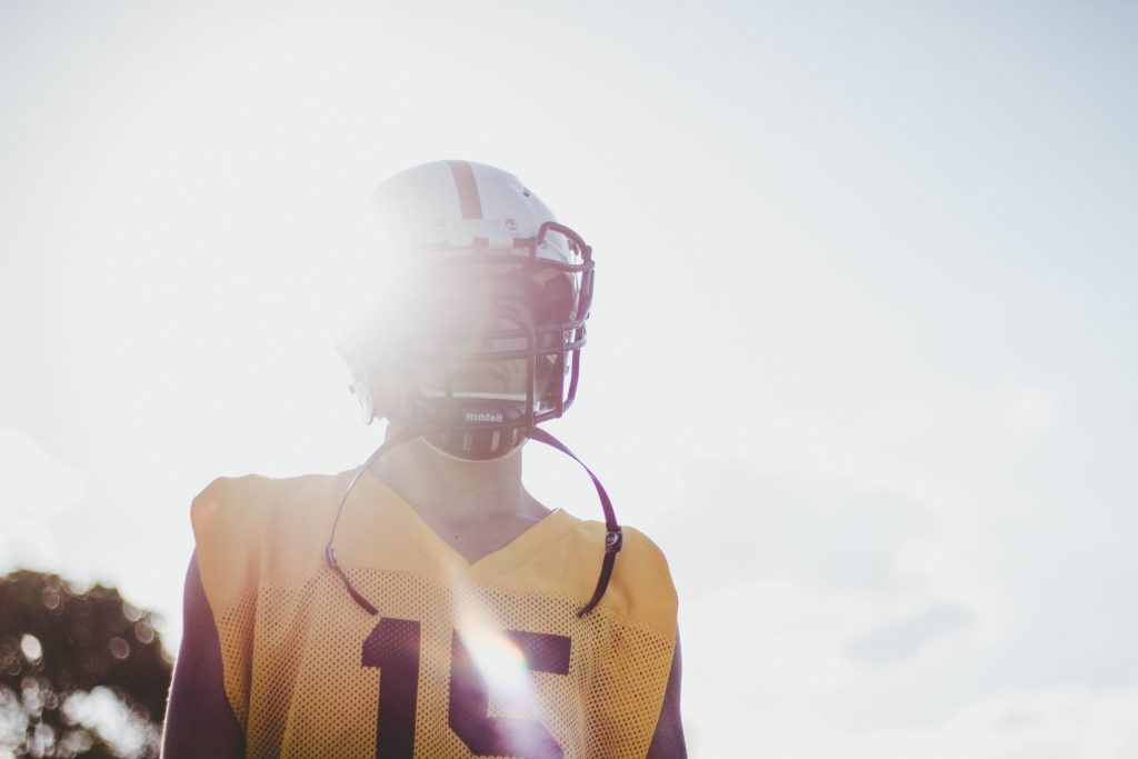 college football player attending a team practice