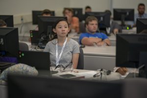 A student sits in a classroom during the GenCyber Summer Program