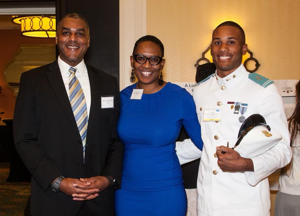 Cadet Logan Miller with his parents after receiving award