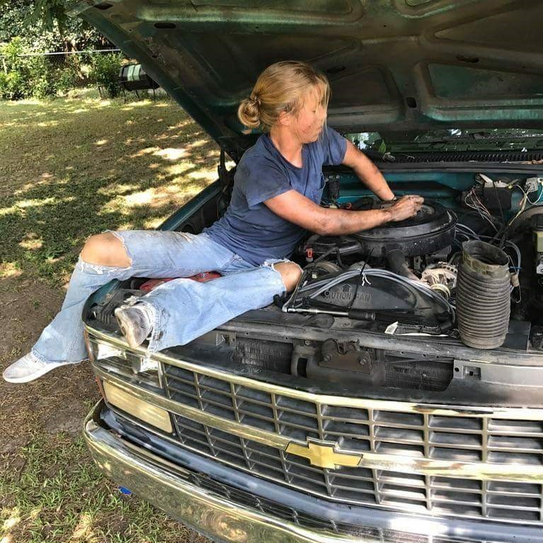 Cadet Col. Sarah Zorn, working on her truck as a teenager.