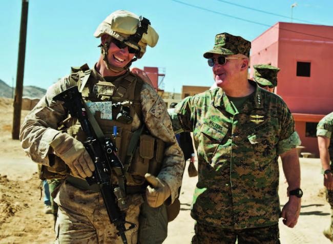 Gen Walters greets a Marine undergoing predeployment training at Marine Corps Air-Ground Combat Center, Twentynine Palms, Calif., May 18, 2017. (photo courtesy of Cpl Hailey D. Clay, USMC)