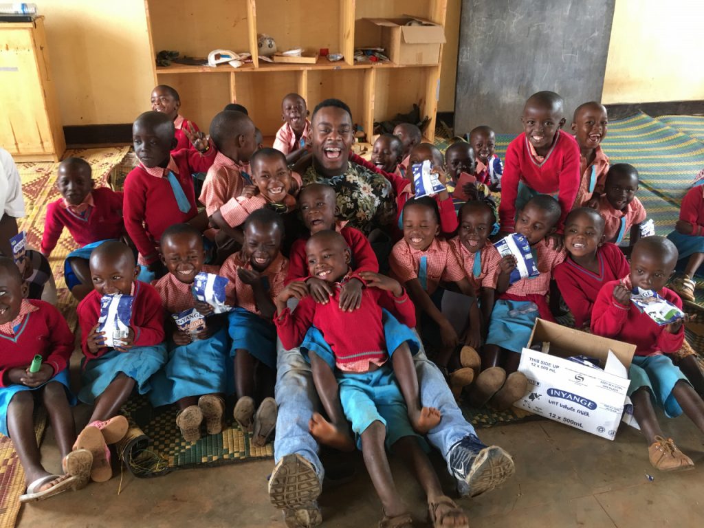 Citadel Regimental Executive Officer, David Days with school children in Kigali Rwanda