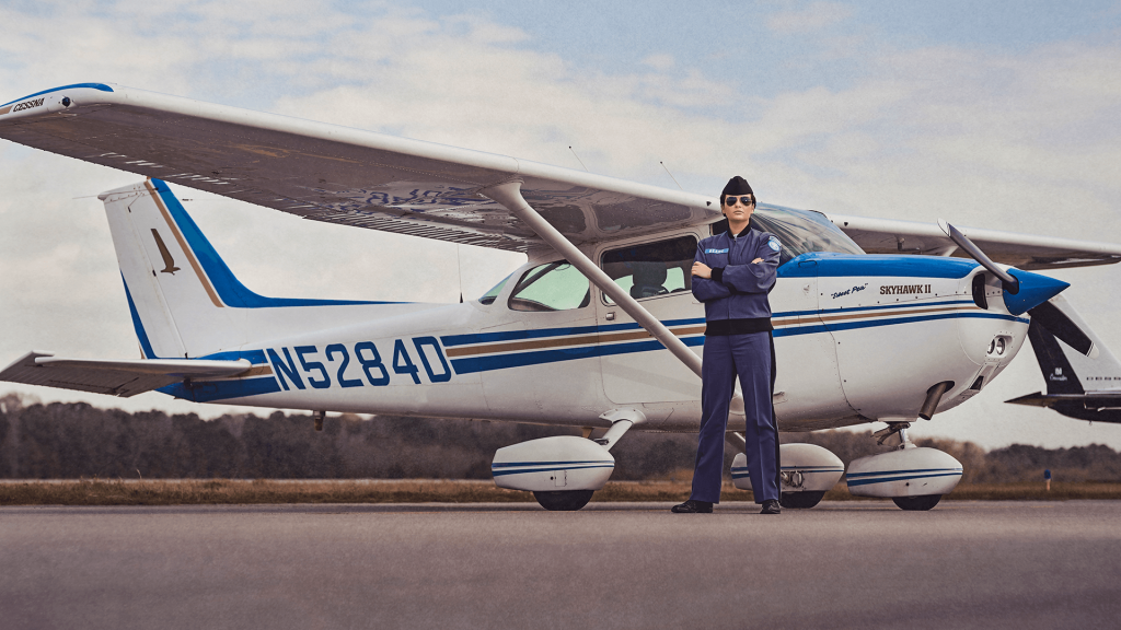 Cadet Jenna Beare stands in front of a Cessna 172 Skyhawk at the Lowcountry Aviation Center