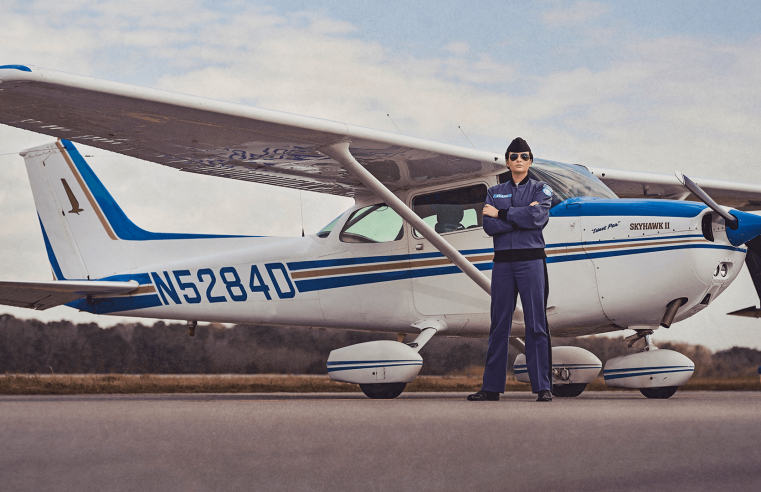 Cadet Jenna Beare stands in front of a Cessna 172 Skyhawk at the Lowcountry Aviation Center
