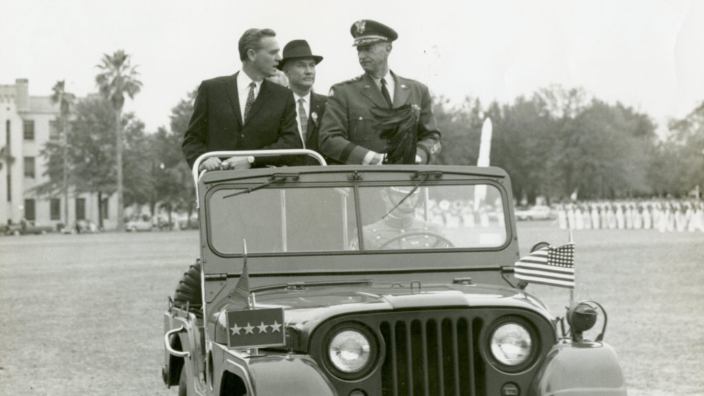 Fritz Hollings (left) with Citadel president Gen. Mark Clark (right) and Sen. Strom Thurmond, in jeep review of South Carolina Corps of Cadets military parade