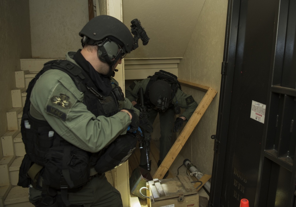 Members of the Charleston County S.W.A.T. team clear a room in a “shoot house” during a joint training exercise