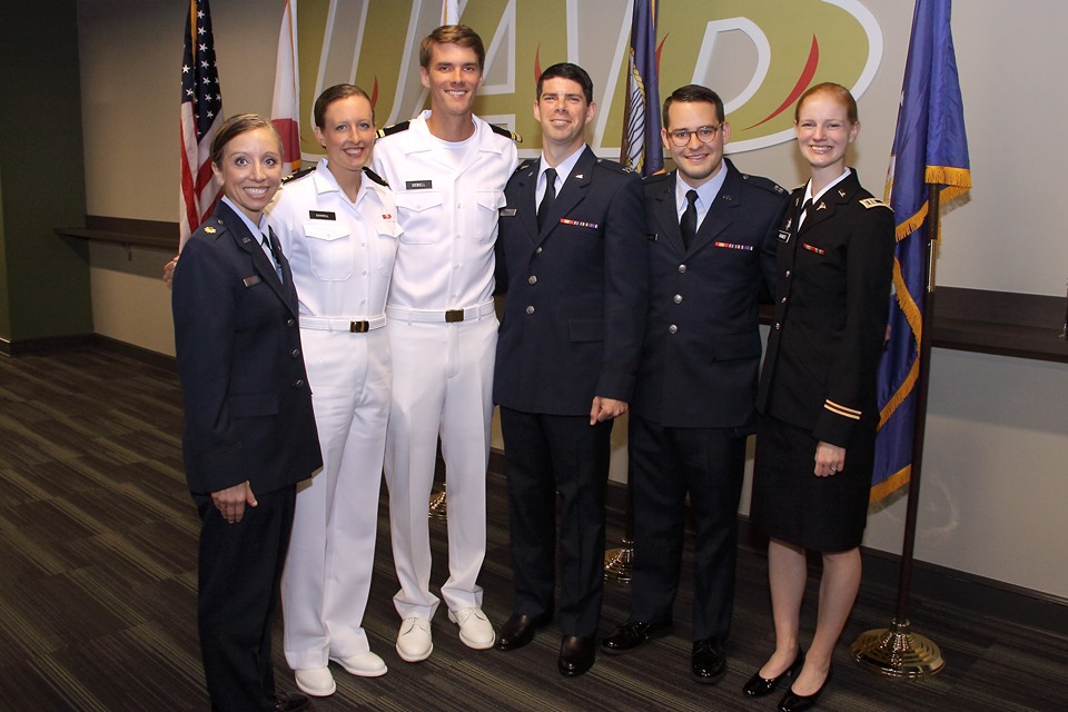 Grace Raines, far right, at UAB Medical School military commissioning and graduation. Raines is one of five Citadel alumni to graduate from medical school in the spring of 2019