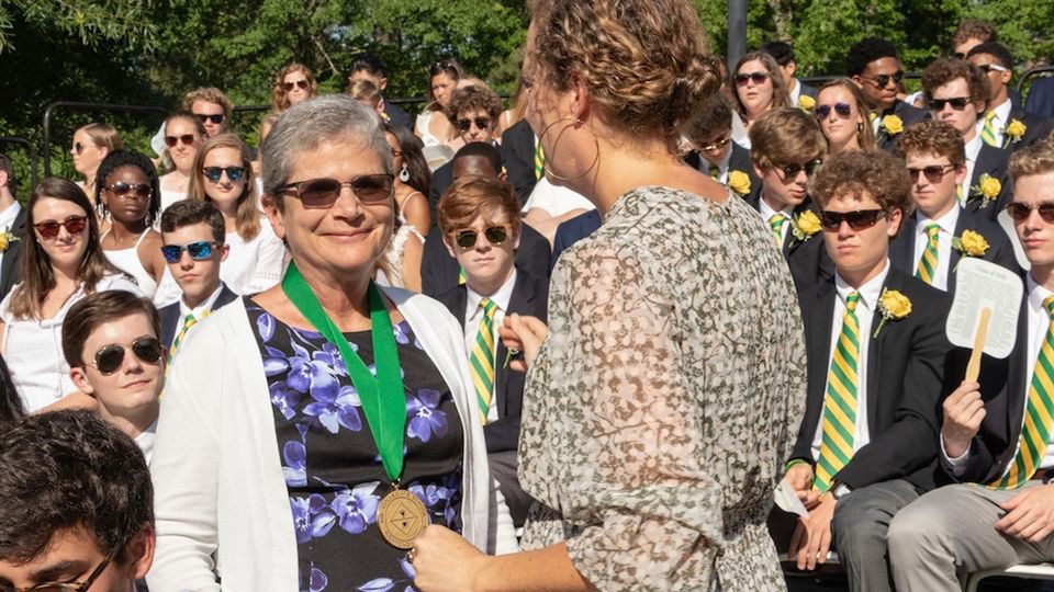 Dr. Conway Fleming Saylor '73 received the Distinguished Alumni Award at Collegiate's Commencement May 24. Neely Markel, Alumni Association president, bestowed the honor.