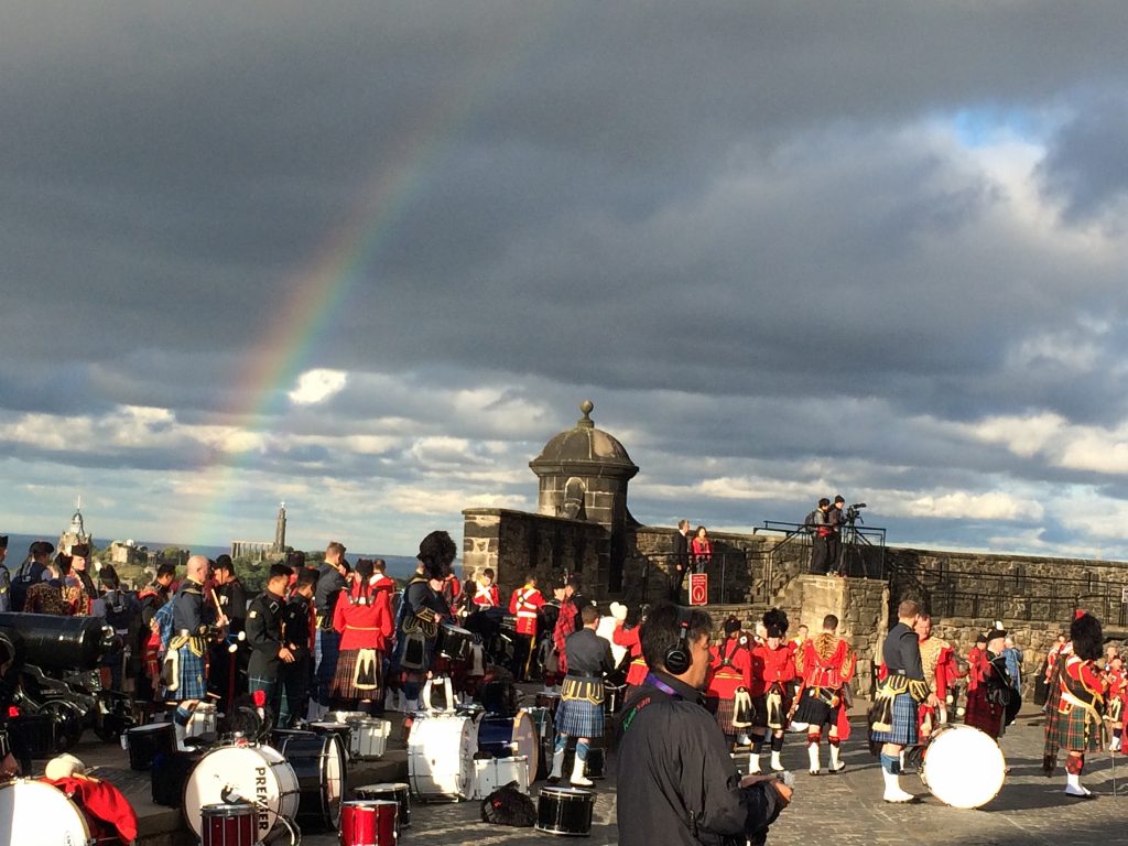 Citadel pipers rehearsing with others from around the world behind the gates of Edinburgh Castle capture a rainbow in 2015