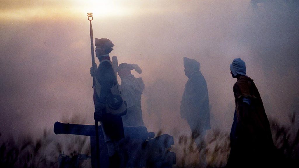 Revolutionary War re-enactors face the Charleston Harbor after firing a cannon from Fort Moultrie during a ceremony commemorating Carolina Day. (Courtesy: The Post and Courier)