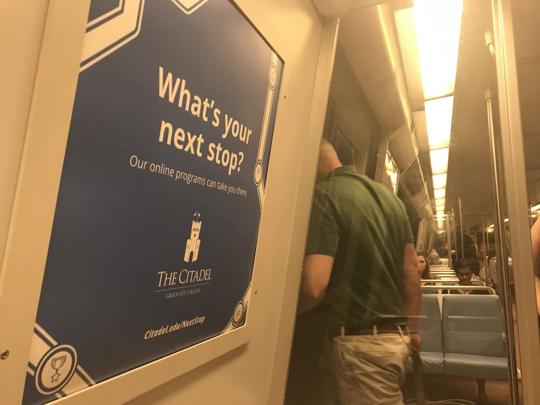 This ad in a Washington DC subway train is part of a $500,000 campaign The Citadel is undertaking to market its growing online course offerings. (Courtesy: Robert Behre, The Post and Courier)