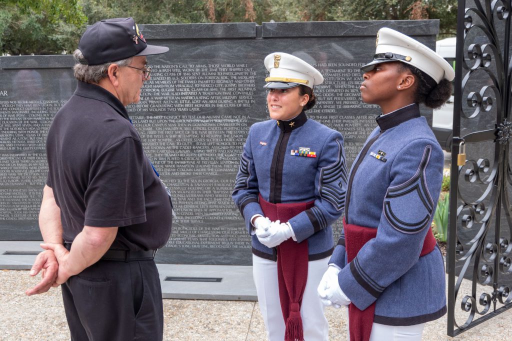 Breana Broad and Ruby Bolden giving a tour of campus to Vietnam veterans