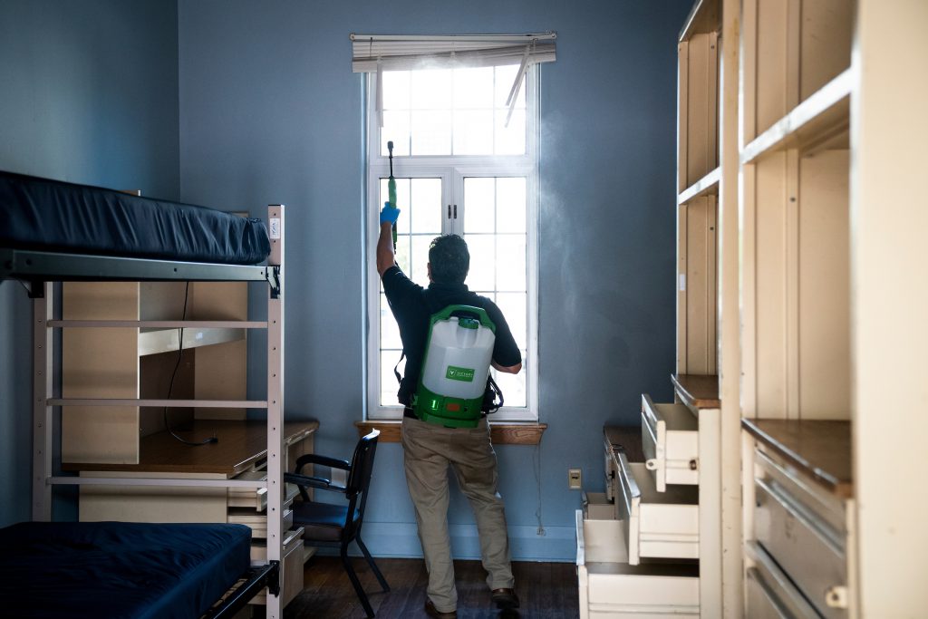 Budd Group expert sanitizing a cadet room at The Citadel