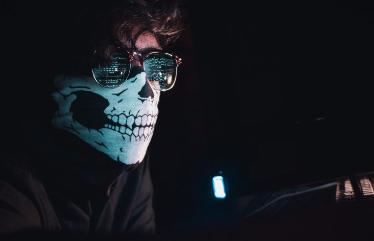 Photo of man wearing skeleton mask disguise
