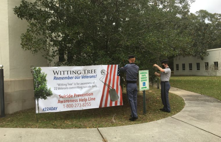 Cadets place dog tags on Whitting Tree on campus