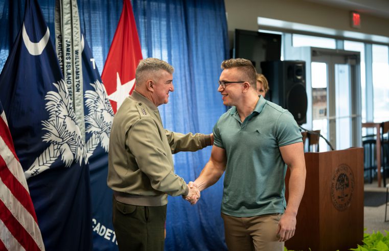 The Citadel President, Gen. Glenn M. Walters, USMC (Ret.) congratulating a veteran student who earned an award in January of 2020