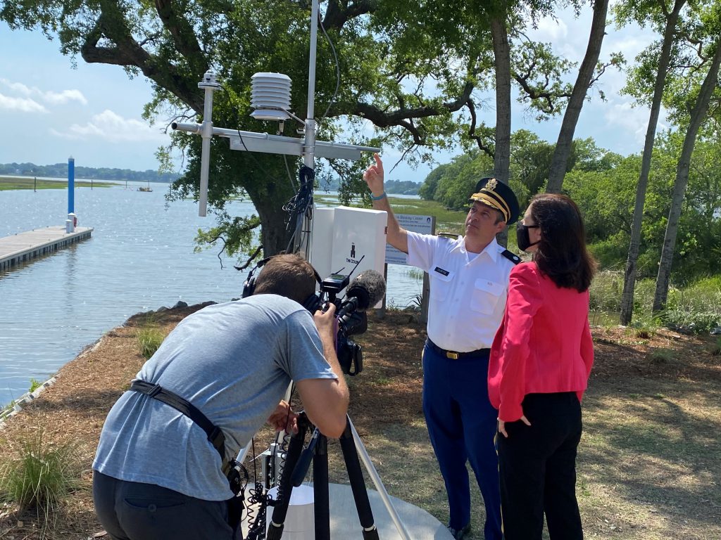 National news correspondent Maya Rodriguez listens to Citadel professor Dr. Scott Curtis discuss the college's weather station on campus