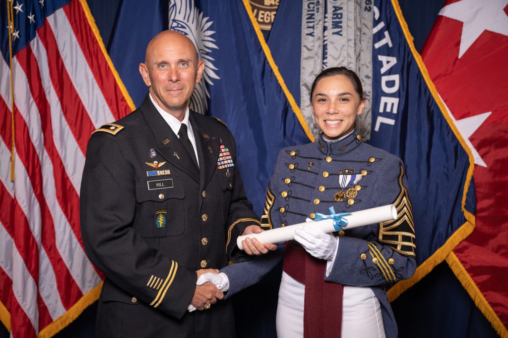 2nd. Lt. Catherine Hill, The Citadel Class of 2021, receives her diploma at graduation from her father, Lt. Col. Rustin Hill, '90The Citadel Class of