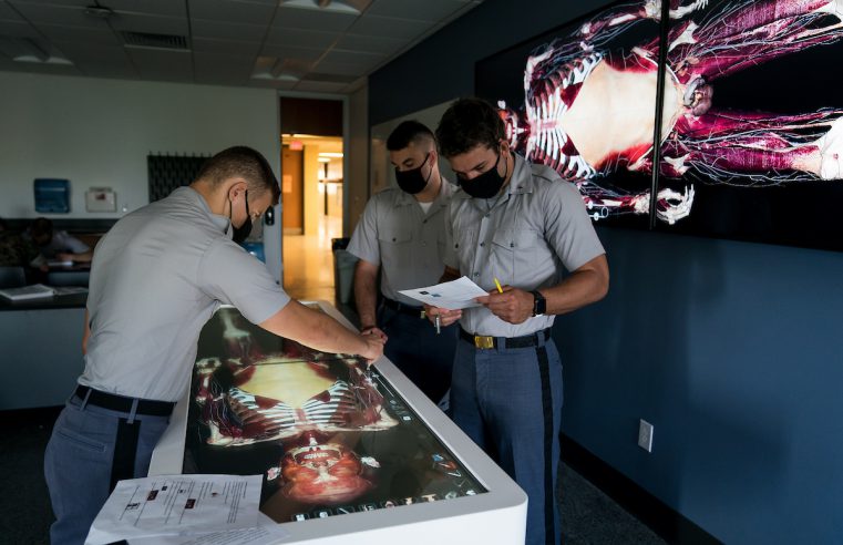 Cadets work with Dr. Clinton Moran, Biology, on a new Anatomage table, the newest addition to Duckett Hall’s state-of-the-art anatomy and physiology lab at The Citadel in Charleston, South Carolina on Tuesday, August 31, 2021. Credit: Cameron Pollack / The Citadel