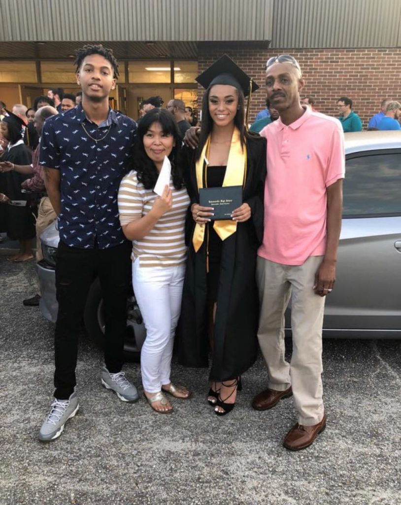 Cadet Mya Dollard with family at high school graduation