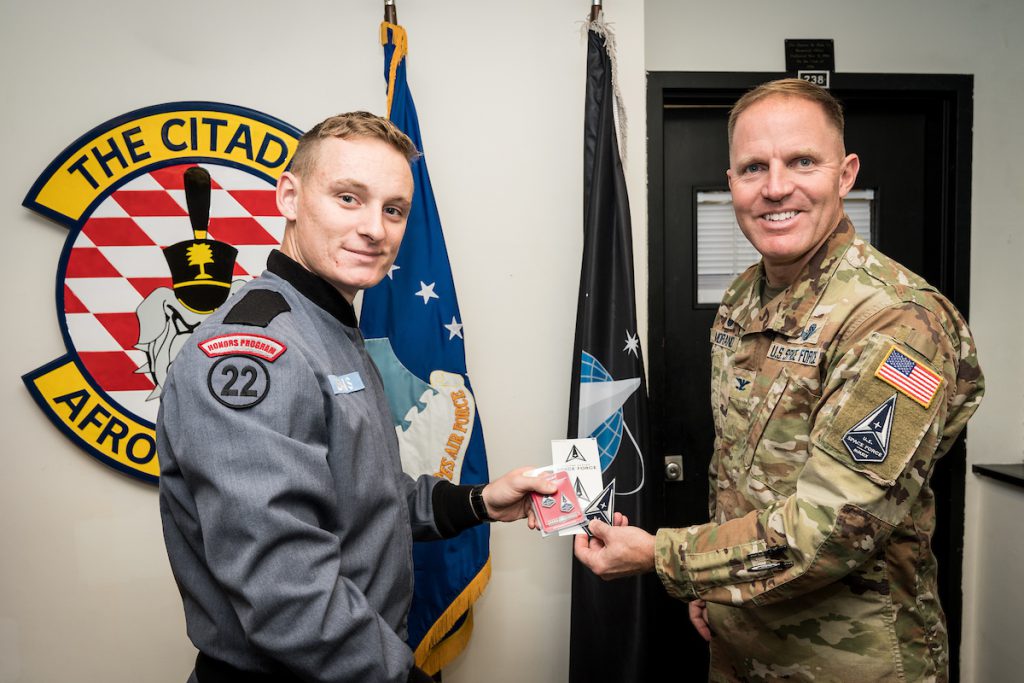 Cadet Conor William Deans, the first Citadel set to commission into the United States Space Force, is congratulated by Col. Matthew Morand, USSF, in Jenkins Hall on Wednesday, November 17, 2021.