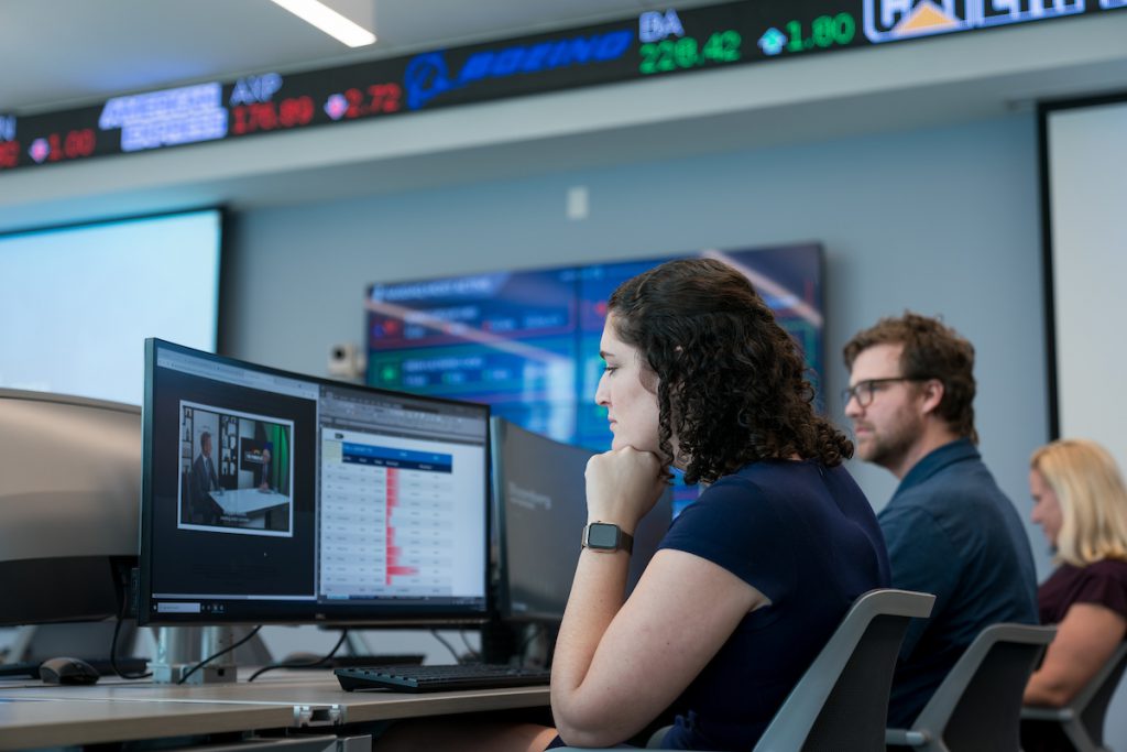 Three citadel graduate college mba students at computers in Bastin Hall on The Citadel campus