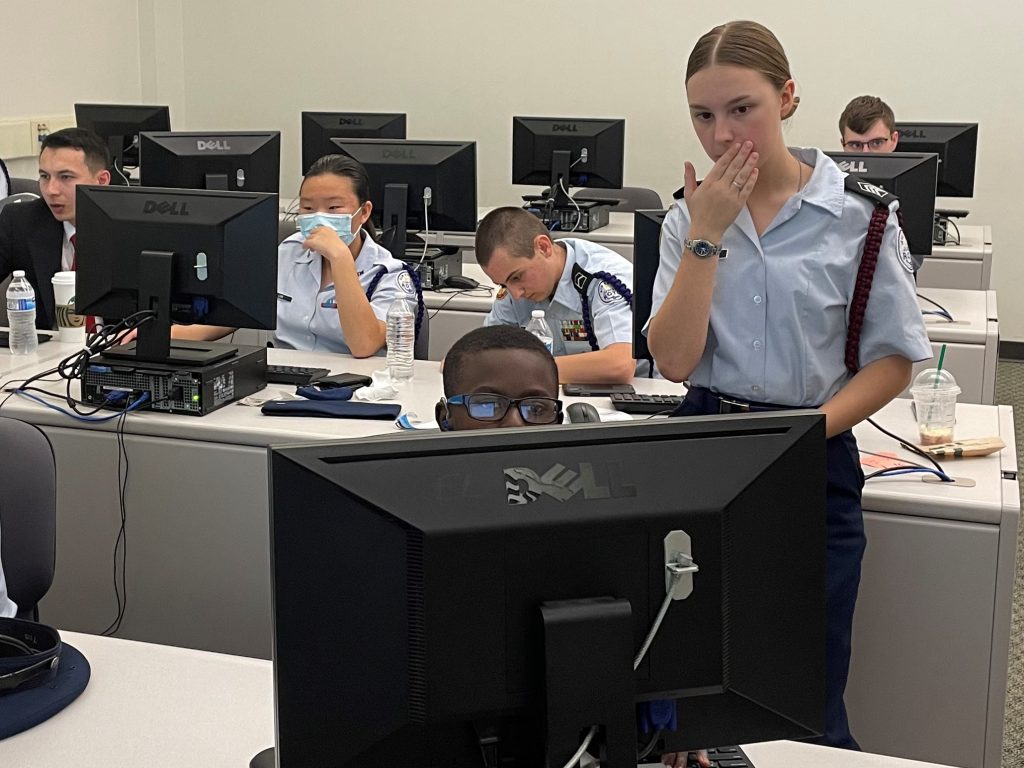 Ashley Ridge High School Air Force JROTC Cyber competition team being trained in lab by Citadel Cadet Trey Stephens