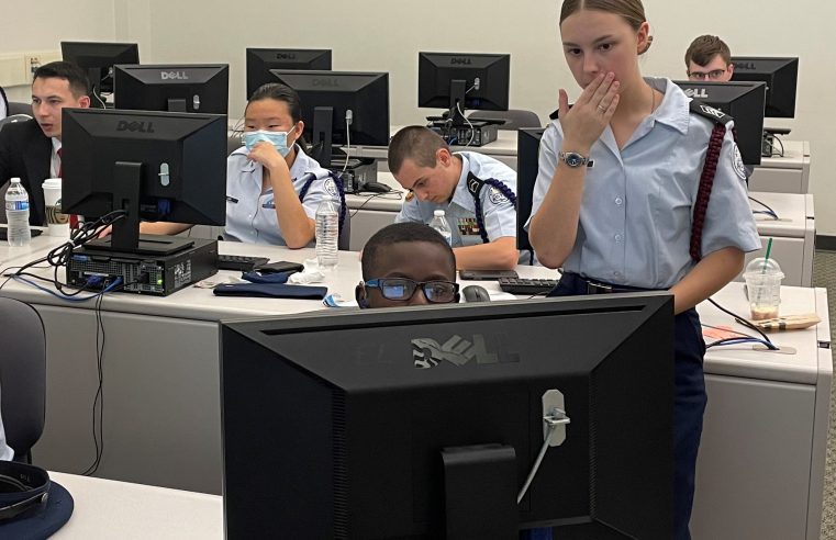 Ashley Ridge High School Air Force JROTC Cyber competition team being trained in lab by Citadel Cadet Trey Stephens
