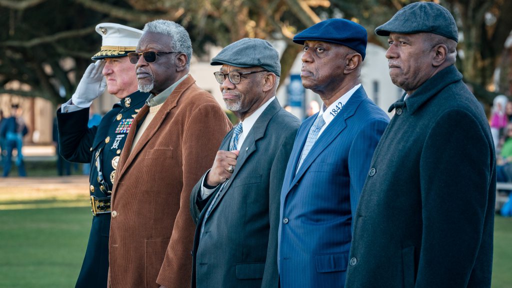 Members of the Class of 1973 stand with Gen. Glenn Walters during parade.