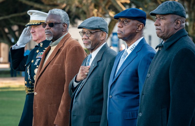 Members of the Class of 1973 stand with Gen. Glenn Walters during parade.